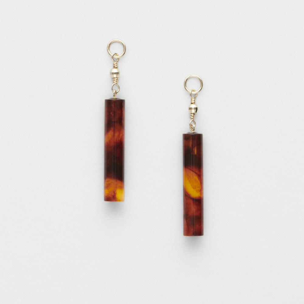 Tortoiseshell bar earrings with gold hooks on a white background from the GemBee Jewellery.