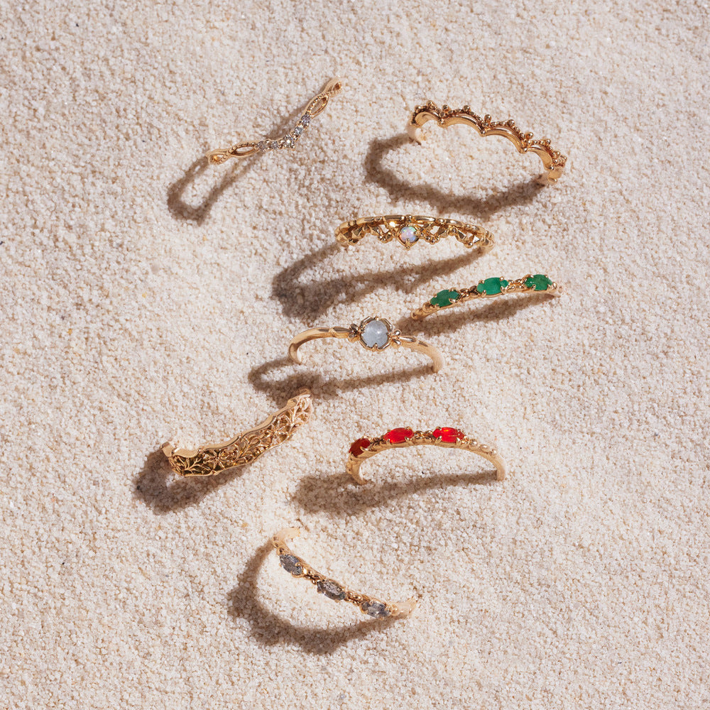 Gold-plated gemstone rings with marquise-cut stones in green, black, white and ruby red — elegant semi-precious jewellery from The GemBee Jewellery.