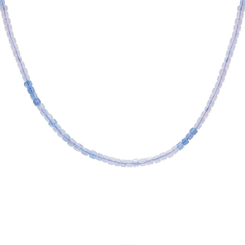 Aquamarine beaded necklace on a white background