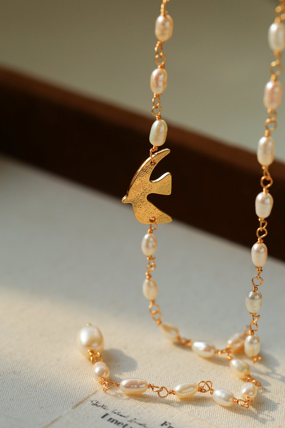 Baroque Pearl Lariat Necklace with Bird Charm